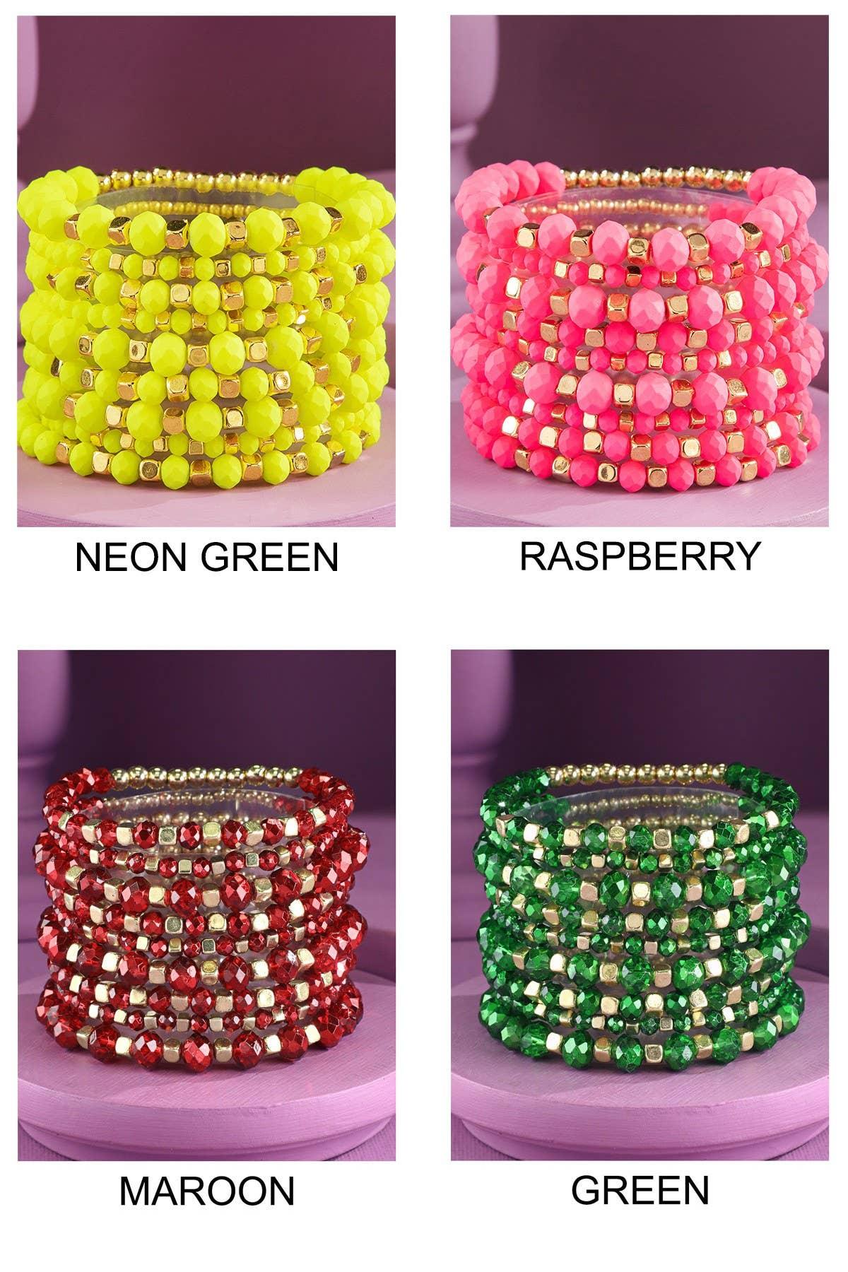 Stacked beaded bracelets in neon green, raspberry pink, maroon, and green colors with gold accents.
