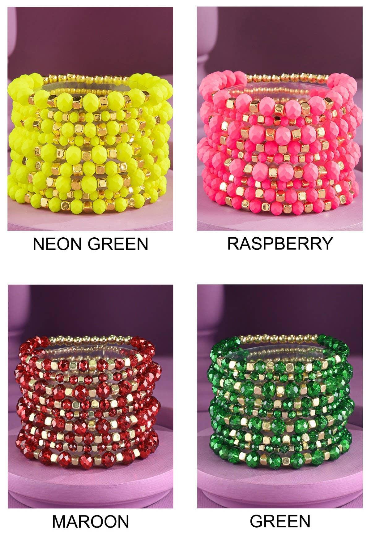 Stacked beaded bracelets in neon green, raspberry pink, maroon, and green colors with gold accents.