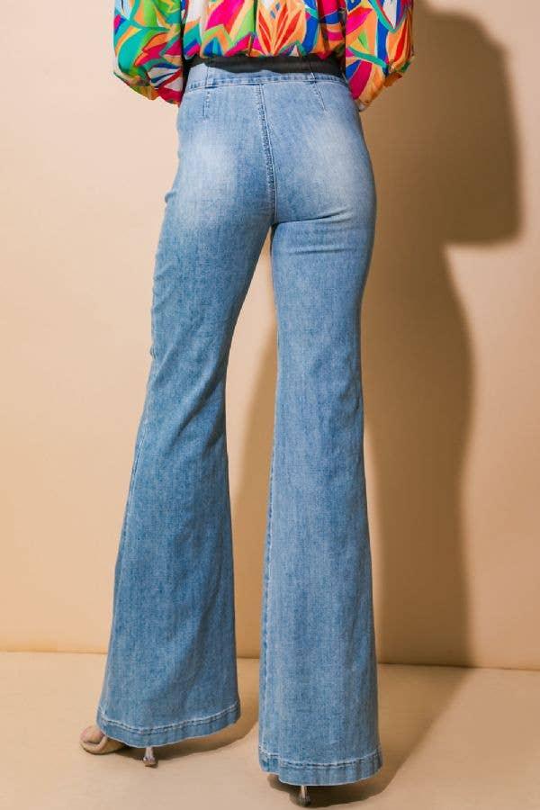 Blue flared jeans paired with colorful blouse, stylish women's fashion