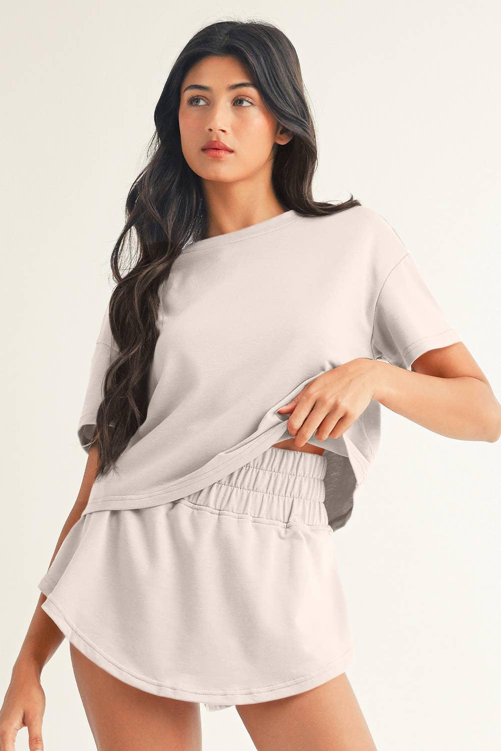 Woman modeling soft gray oversized crop top and matching shorts set, casual loungewear outfit