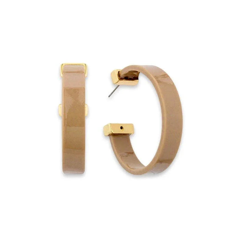 Glossy beige resin hoop earrings with gold accents on a white background