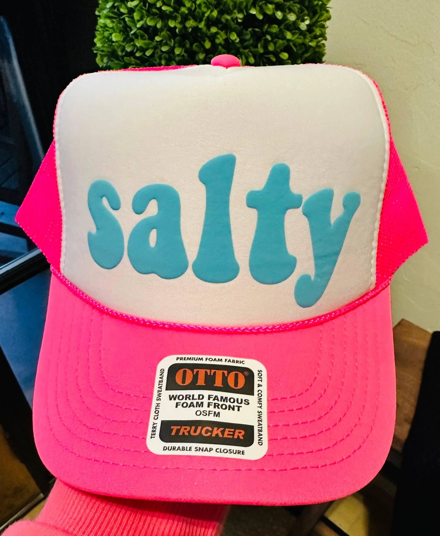 Pink trucker hat with 'salty' in blue foam letters, premium OTTO brand design