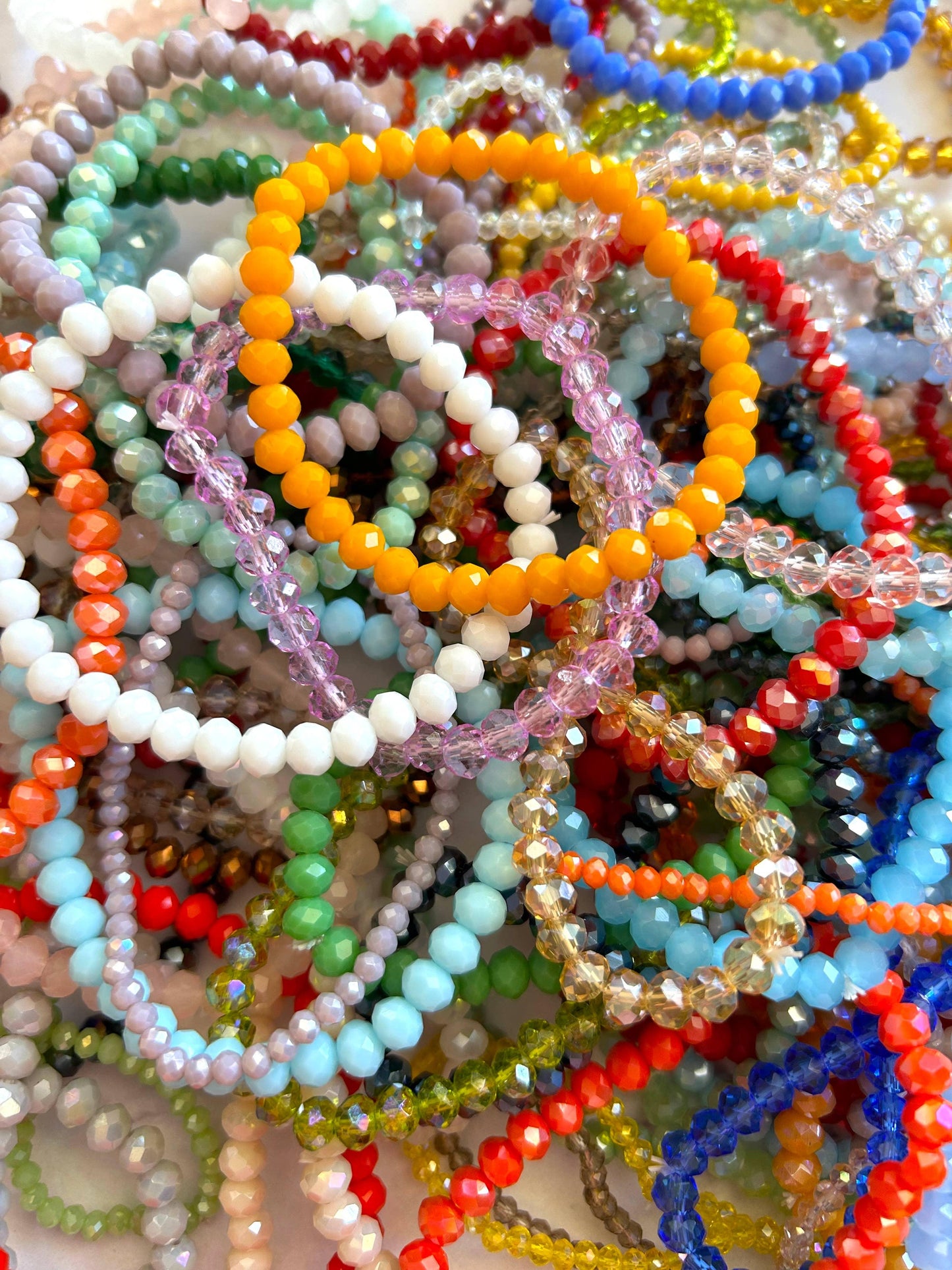 Colorful beaded bracelets in assorted styles and vibrant hues, perfect for fashion accessories.