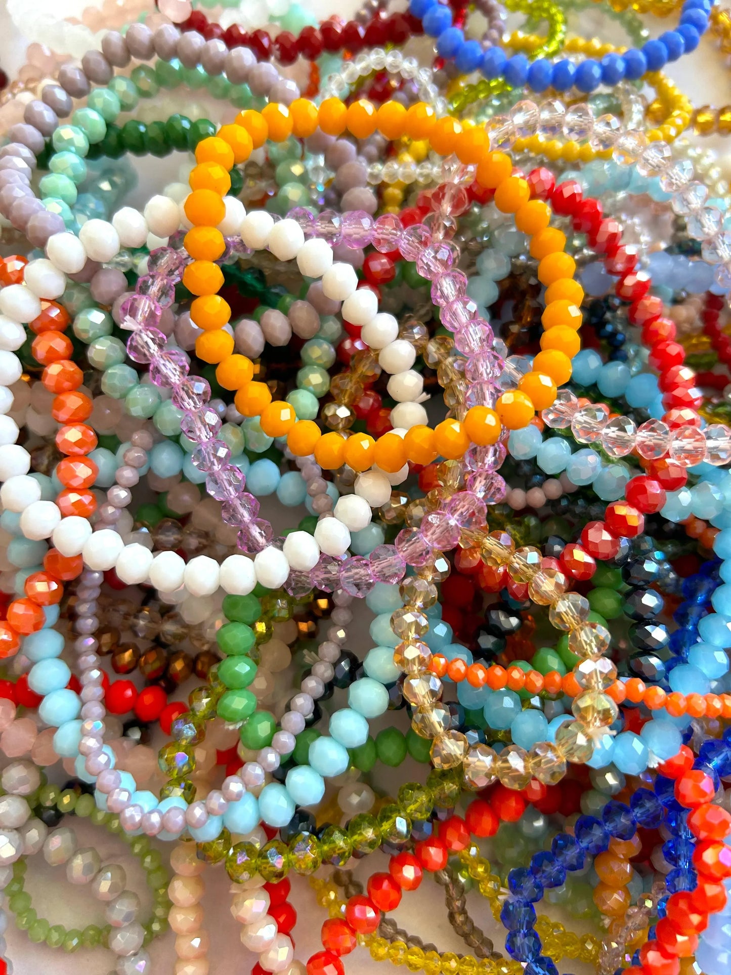 Colorful beaded bracelets in assorted styles and vibrant hues, perfect for fashion accessories.