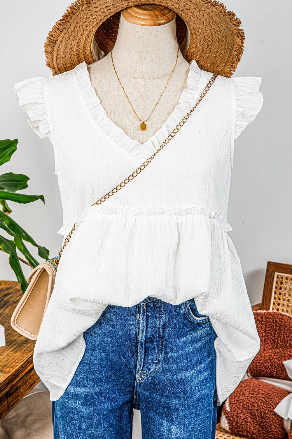 White ruffle sleeve top with denim jeans, straw hat, and gold chain bag for summer fashion