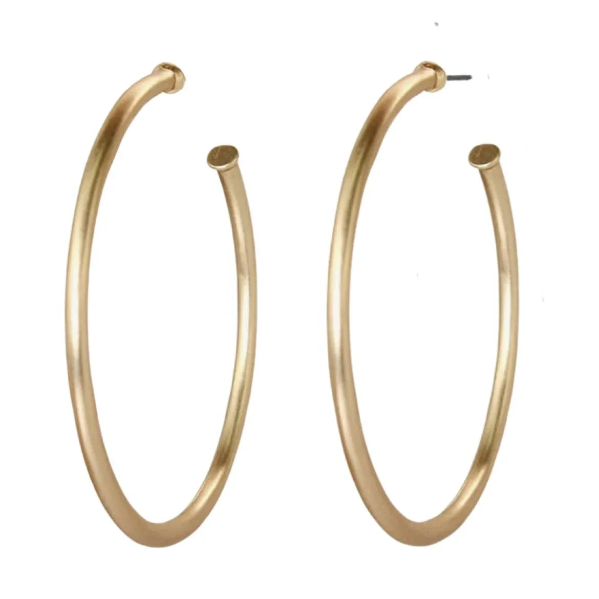Gold-tone large hoop earrings with smooth finish on white background