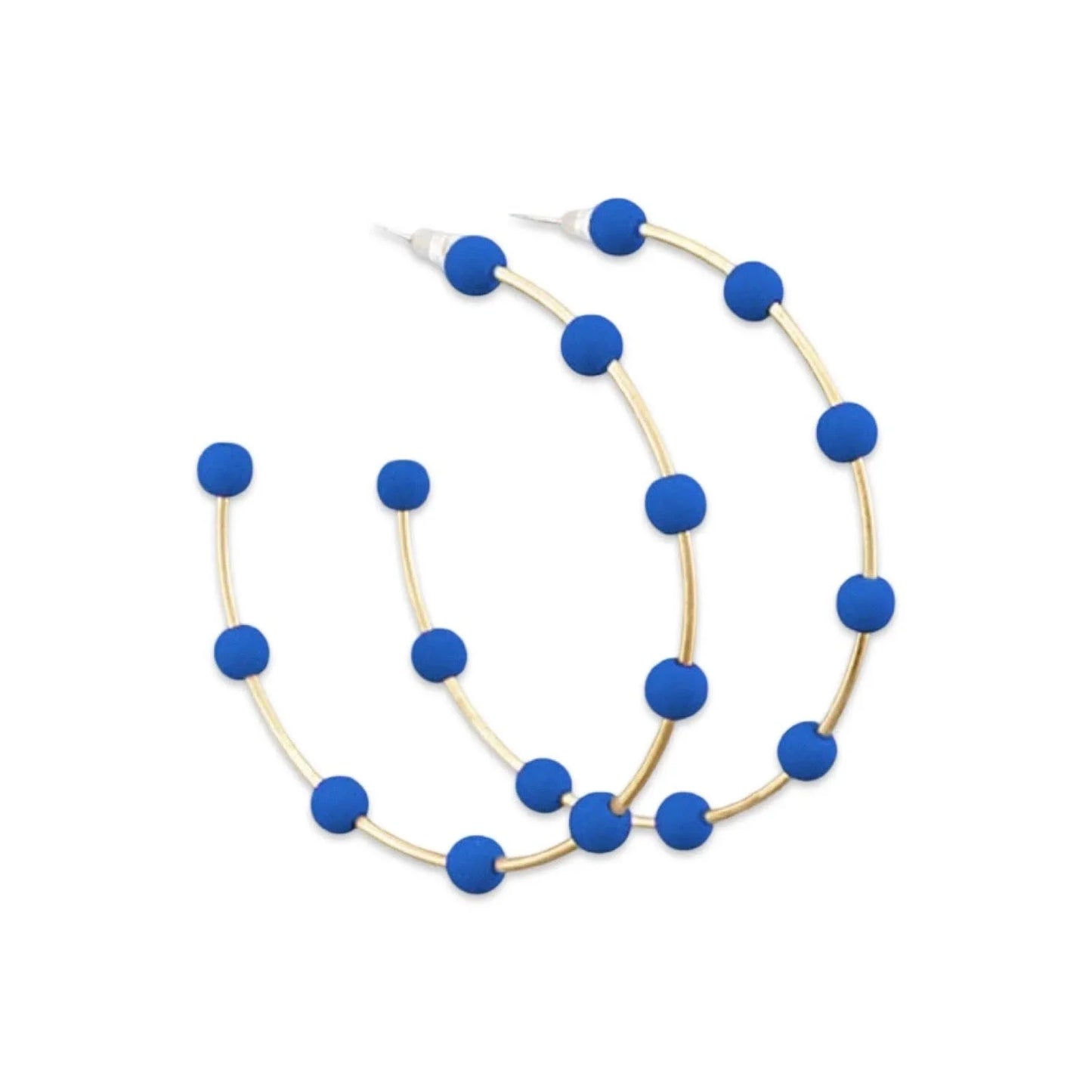 Gold hoop earrings with bold blue beads on white background