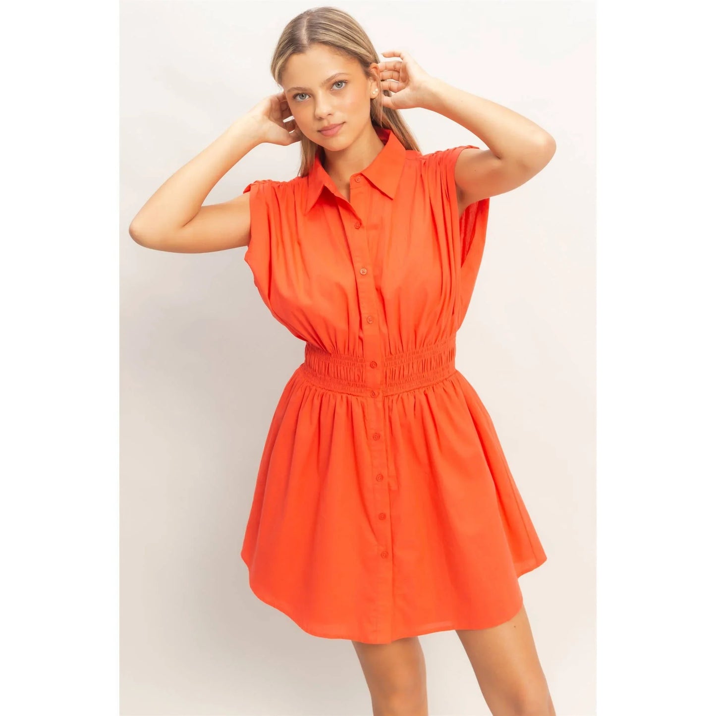 Vibrant orange button-down shirt dress with smocked waist and short sleeves