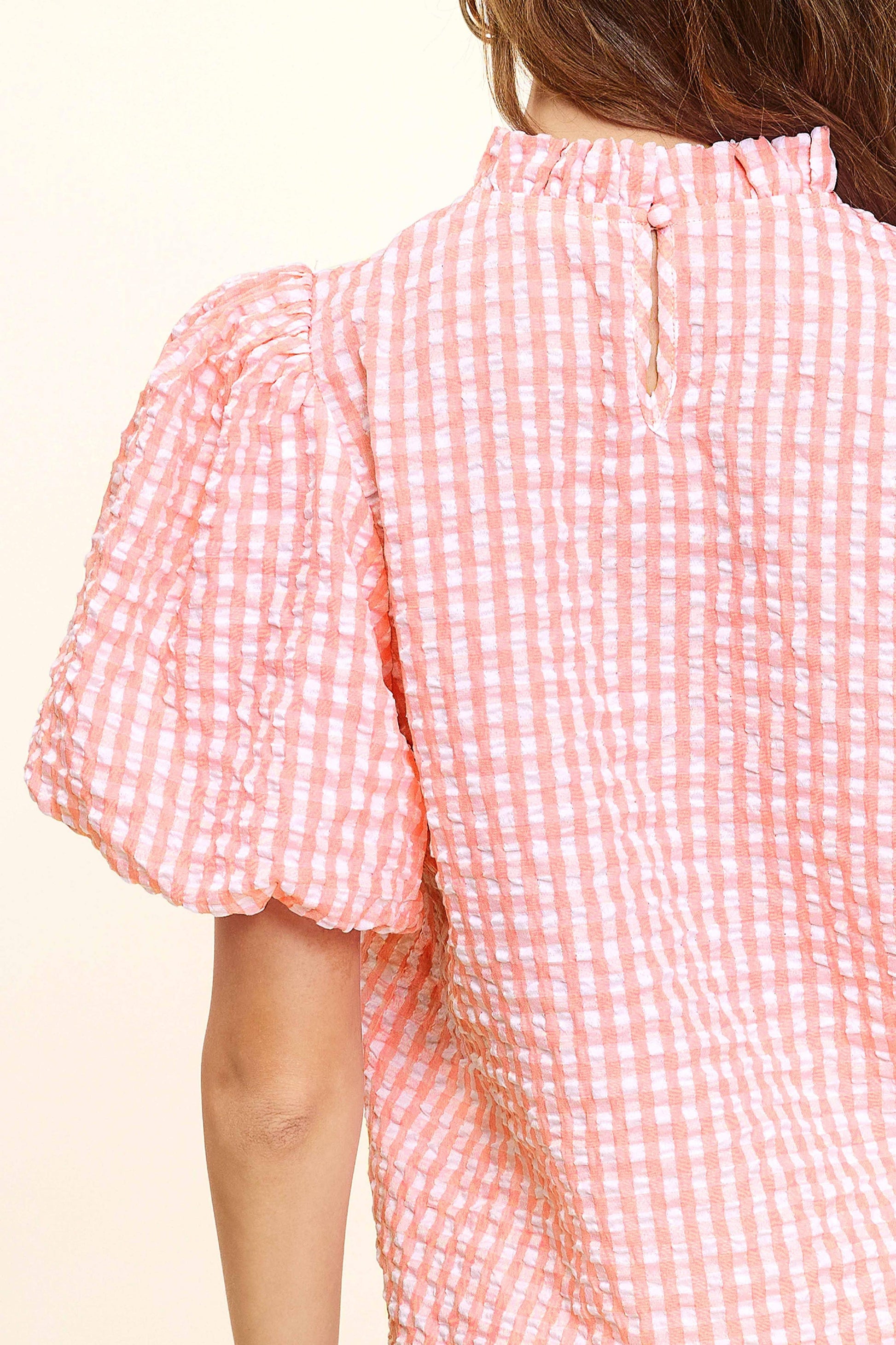 Back detail of pink gingham puff sleeve blouse with ruffle collar from Lou's Boutique